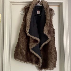 Reversible faux fur vest.